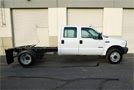 2004 Ford F-550 6.0L Diesel 4 x 4 6 Spd MT. Cab & Chassis - Passenger Side