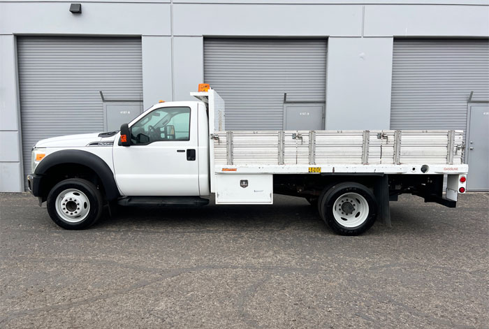 2012 Ford F-550 XLT 12' Stakebed Truck - Driver Side
