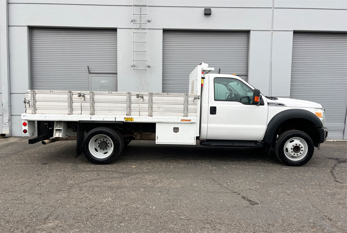 2012 Ford F-550 XLT 12' Stakebed Truck - Passenger Side